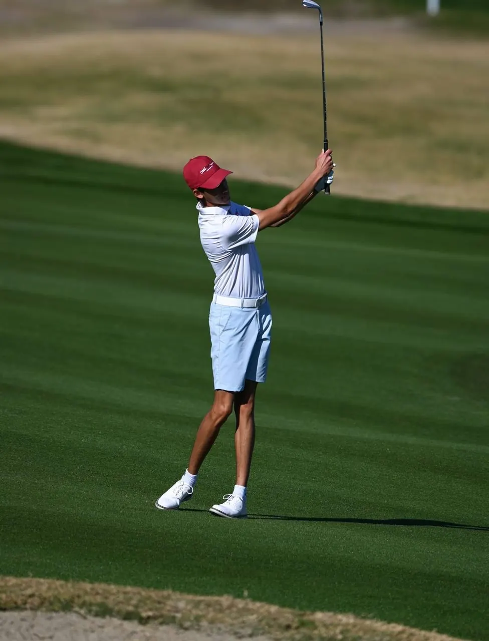 Cameron Rajput finishing an iron shot